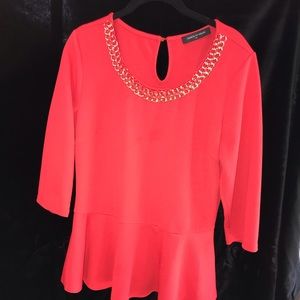Red peplum shirt.